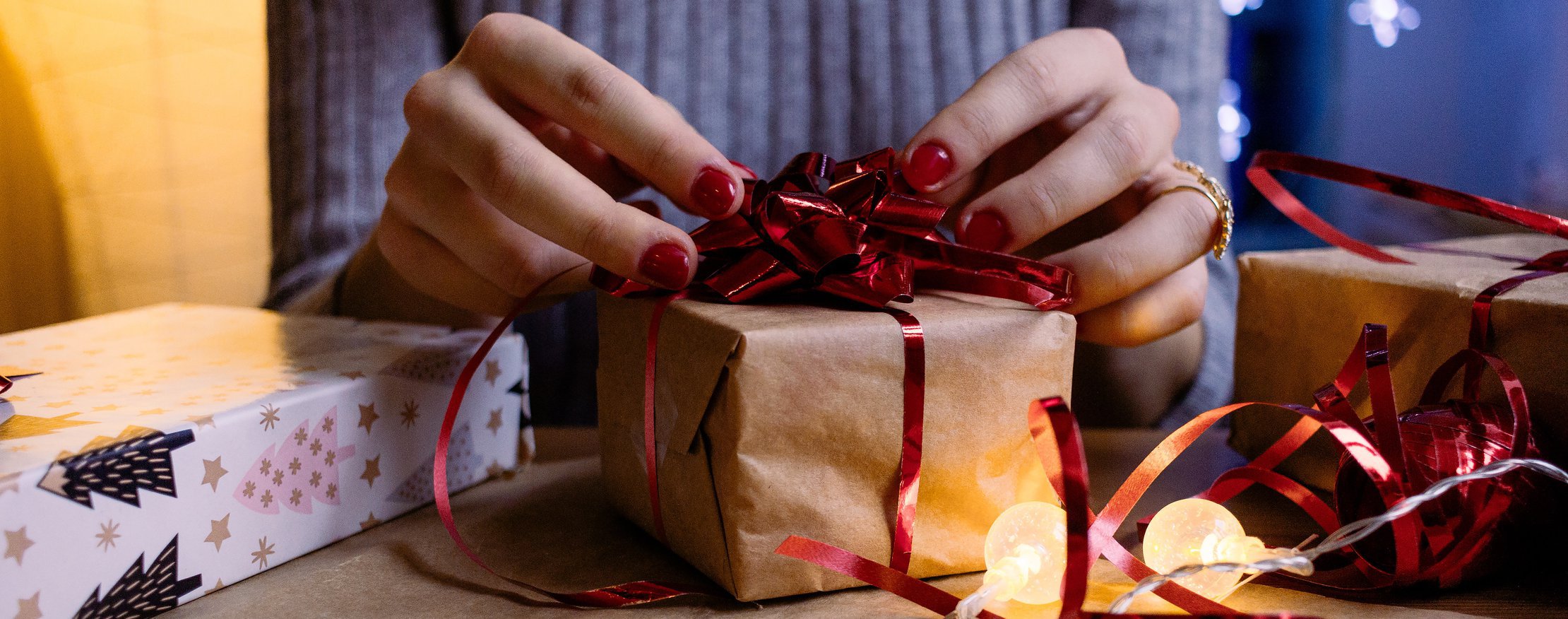 woman wrapping gift